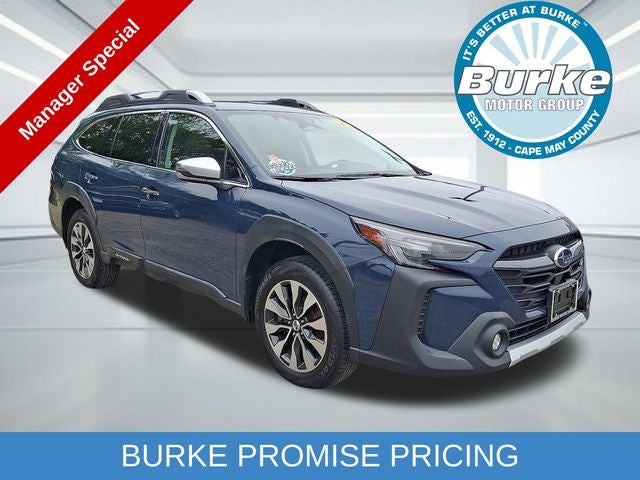 2024 Subaru Outback Touring in Cosmic Blue Pearl — front three-quarter view